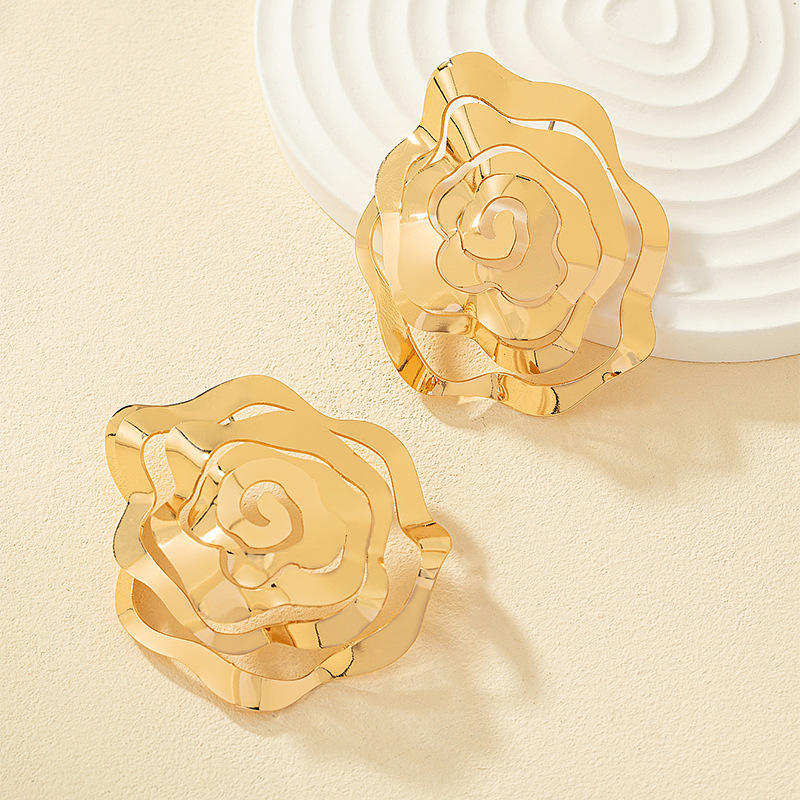 Unique hollowed gold rose flower stud earring